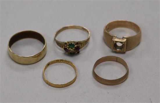 Four assorted 9ct gold rings, including and early 20th century suffragette gem set ring (stones missing) and an 18ct gold band.